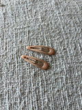 2 soft beige hair clips